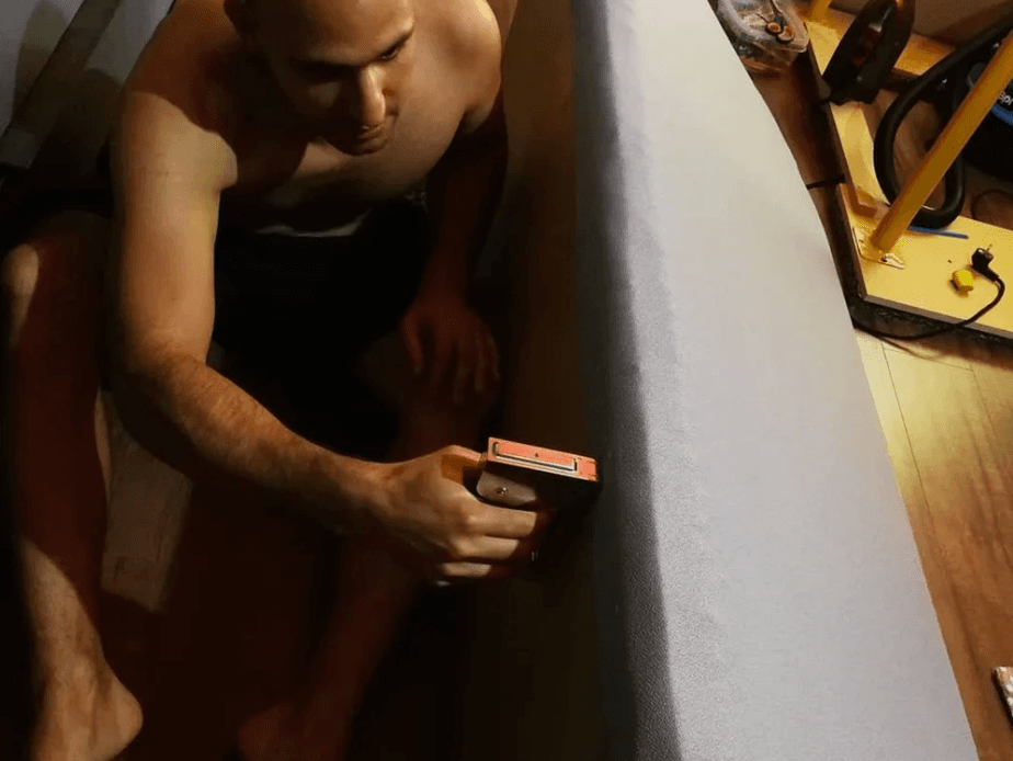 Stapling the fabric on the bass trap corner resonator